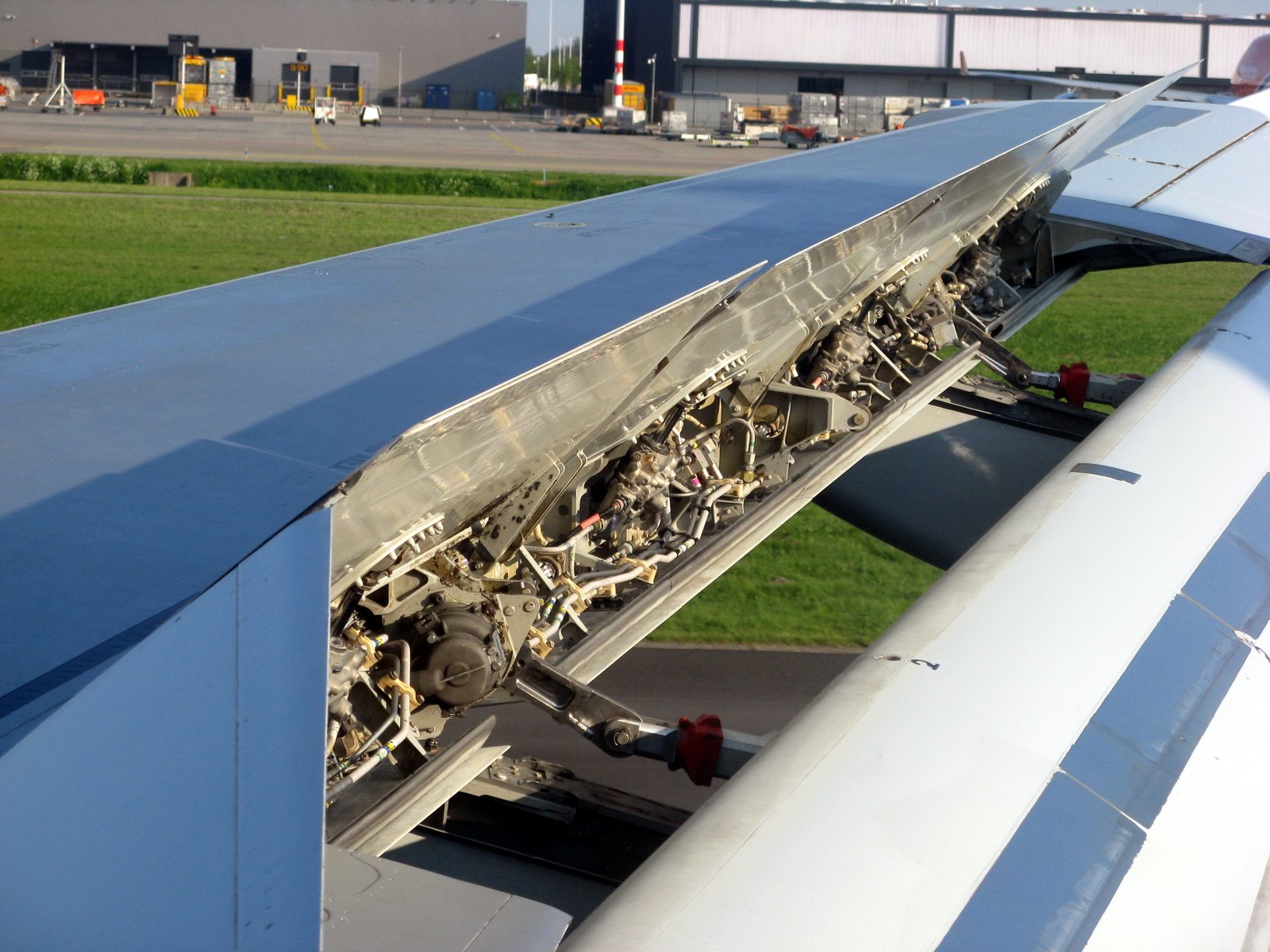 What are Spoilers and what do the Aerodynamics of the plane do?