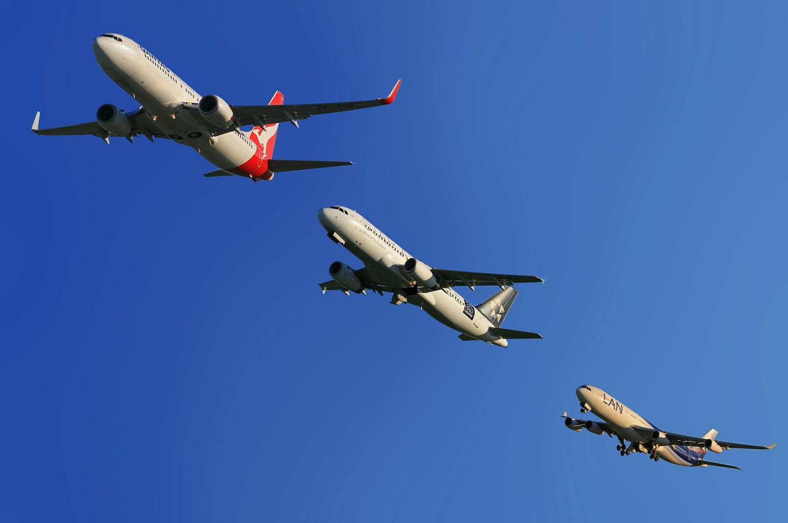 three gray airplane on air