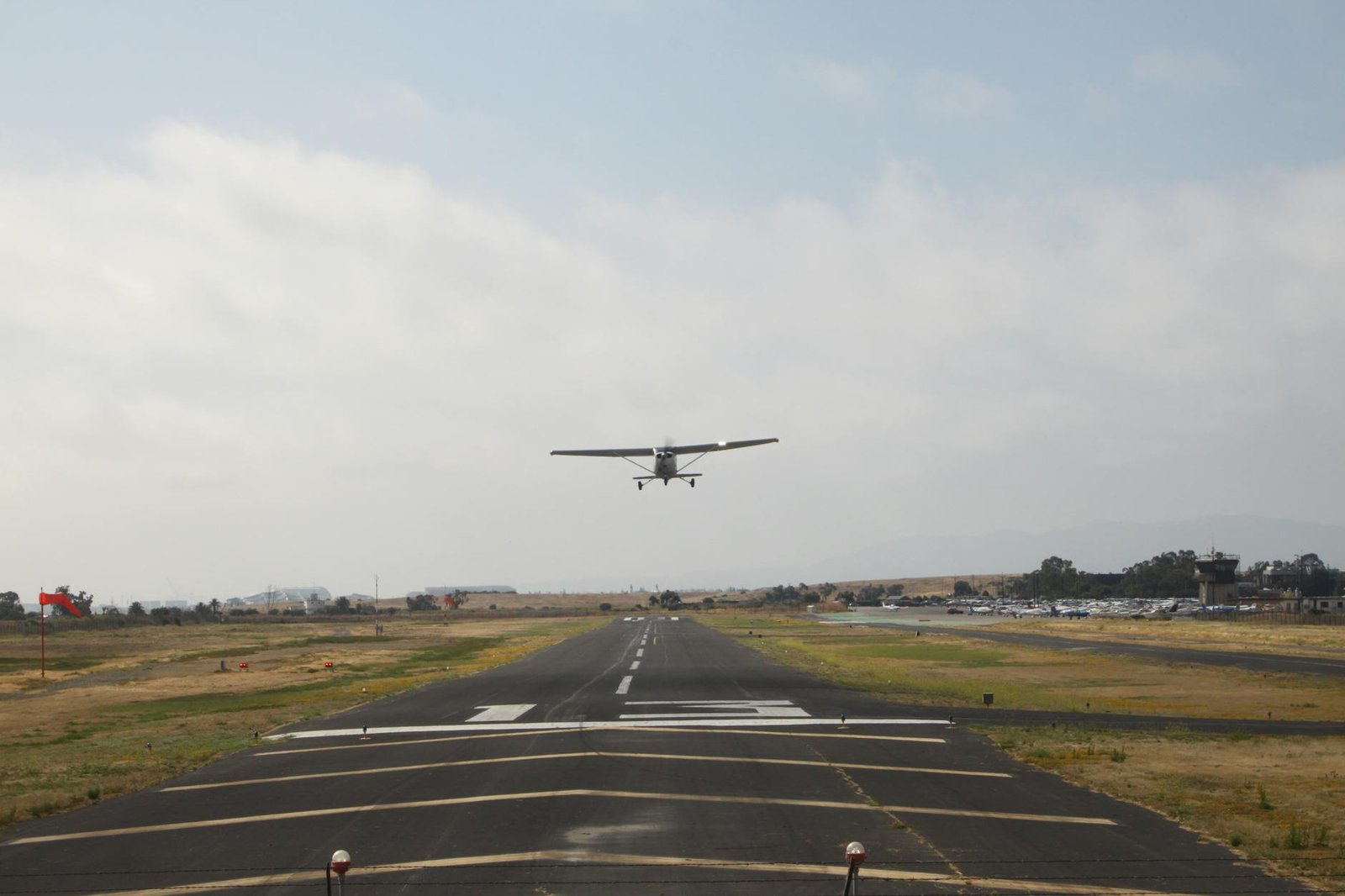 small aircraft taking off from runway